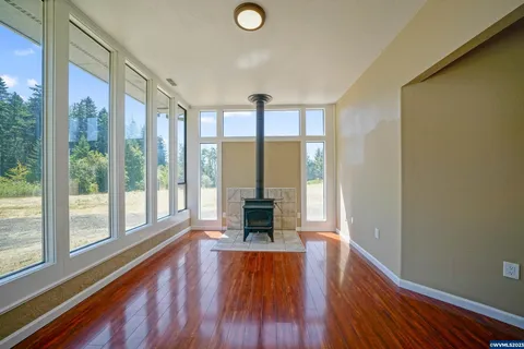 Ranch house sunroom with a wood stove