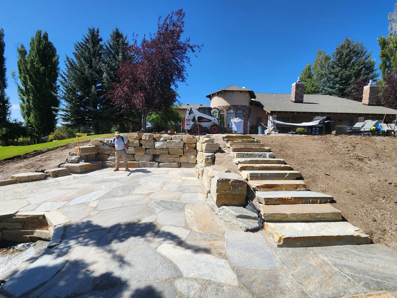 Natural stone steps and patio landscaping